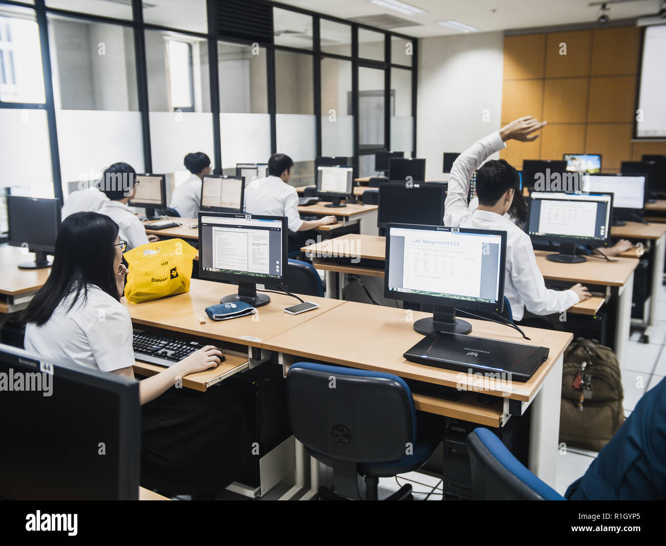 Samut Prakan, Thailand - November, 2018: Engineering students of Assumption University working in computer laboratory on their programming project Stock Photo