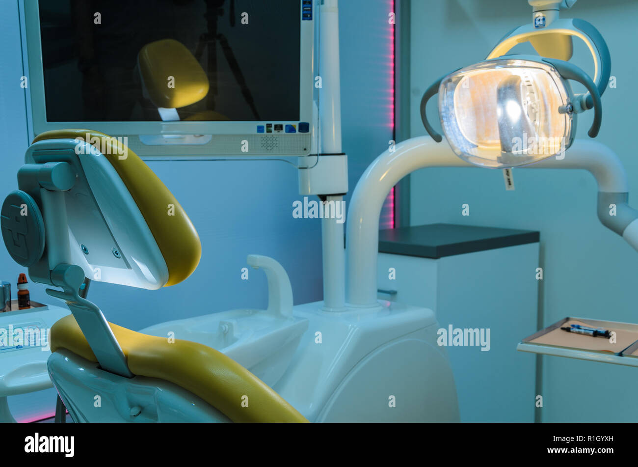 Dentist office with blue light, and one lamp on Stock Photo Alamy