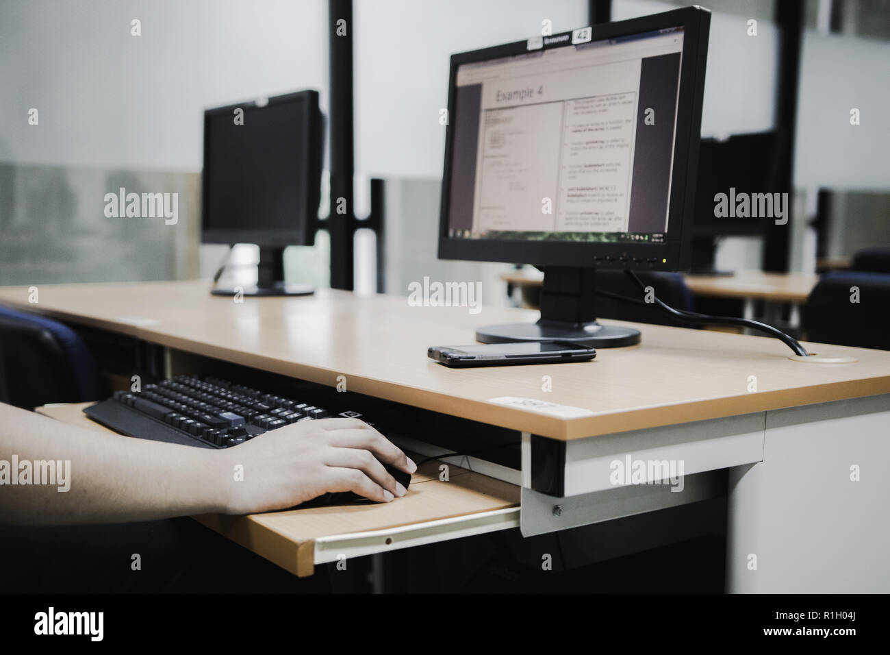 Samut Prakan, Thailand - November, 2018: Engineering students of Assumption University working in computer laboratory on their programming project Stock Photo