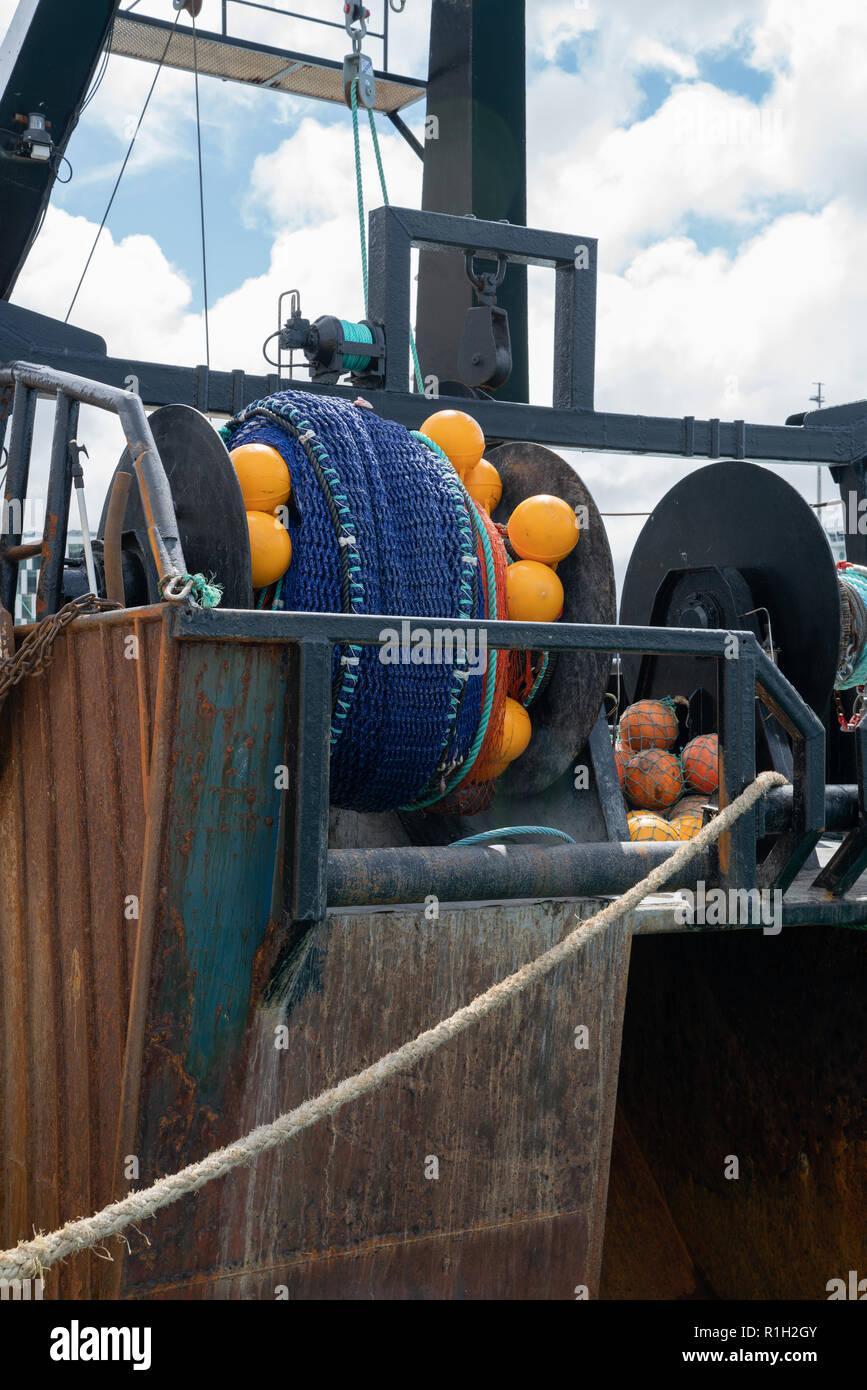 Commercial fishing boats gear and nets moored at Wharf Wellington Stock
