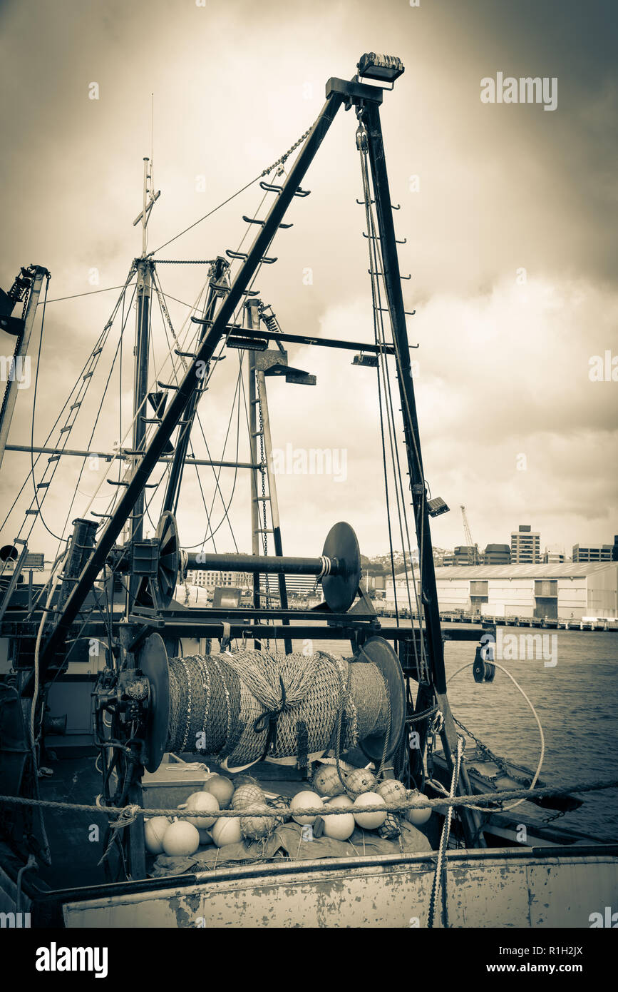 Old style image commercial fishing boats gear and nets moored at Wharf  Wellington Stock Photo - Alamy