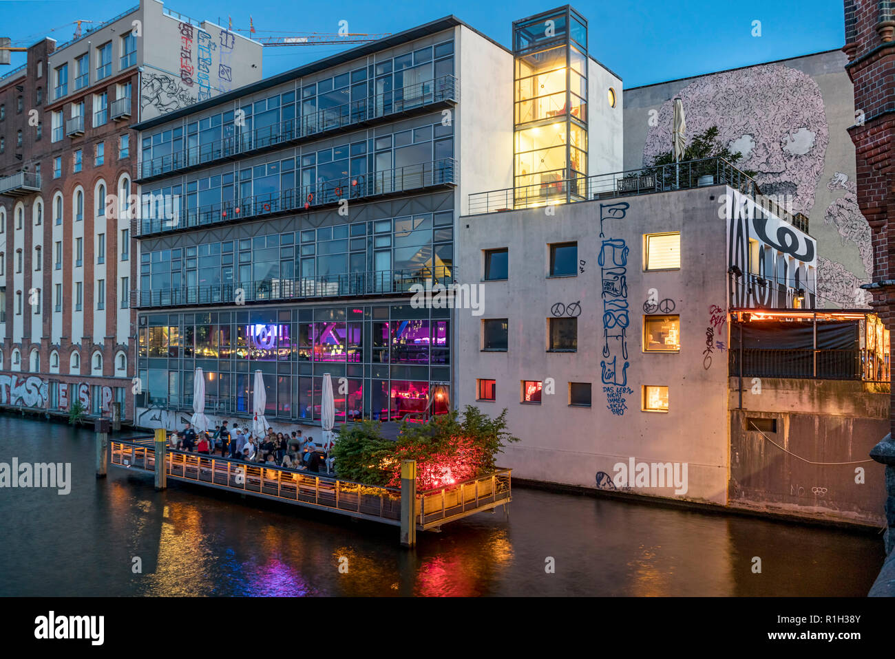 Watergate Club open air terasse on river Spree at twilight, Berlin, Germany Stock Photo