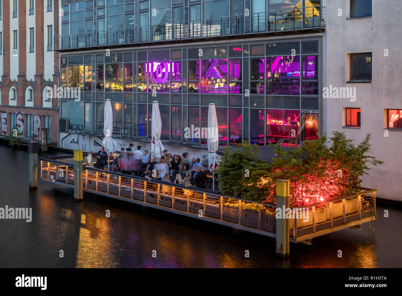 Watergate Club open air terasse on river Spree at twilight, Berlin, Germany Stock Photo