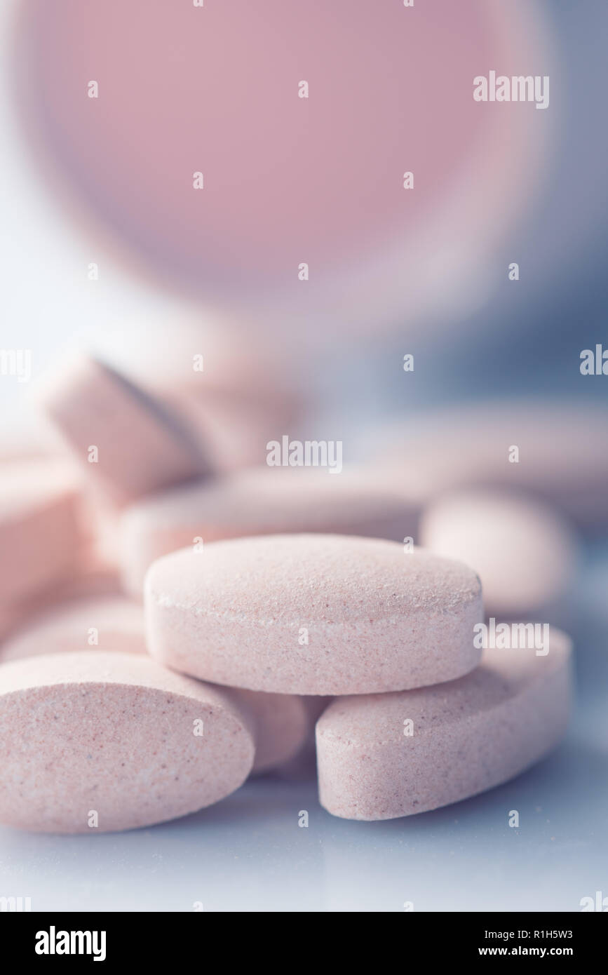 Vitamin supplement pills close up with selective focus Stock Photo