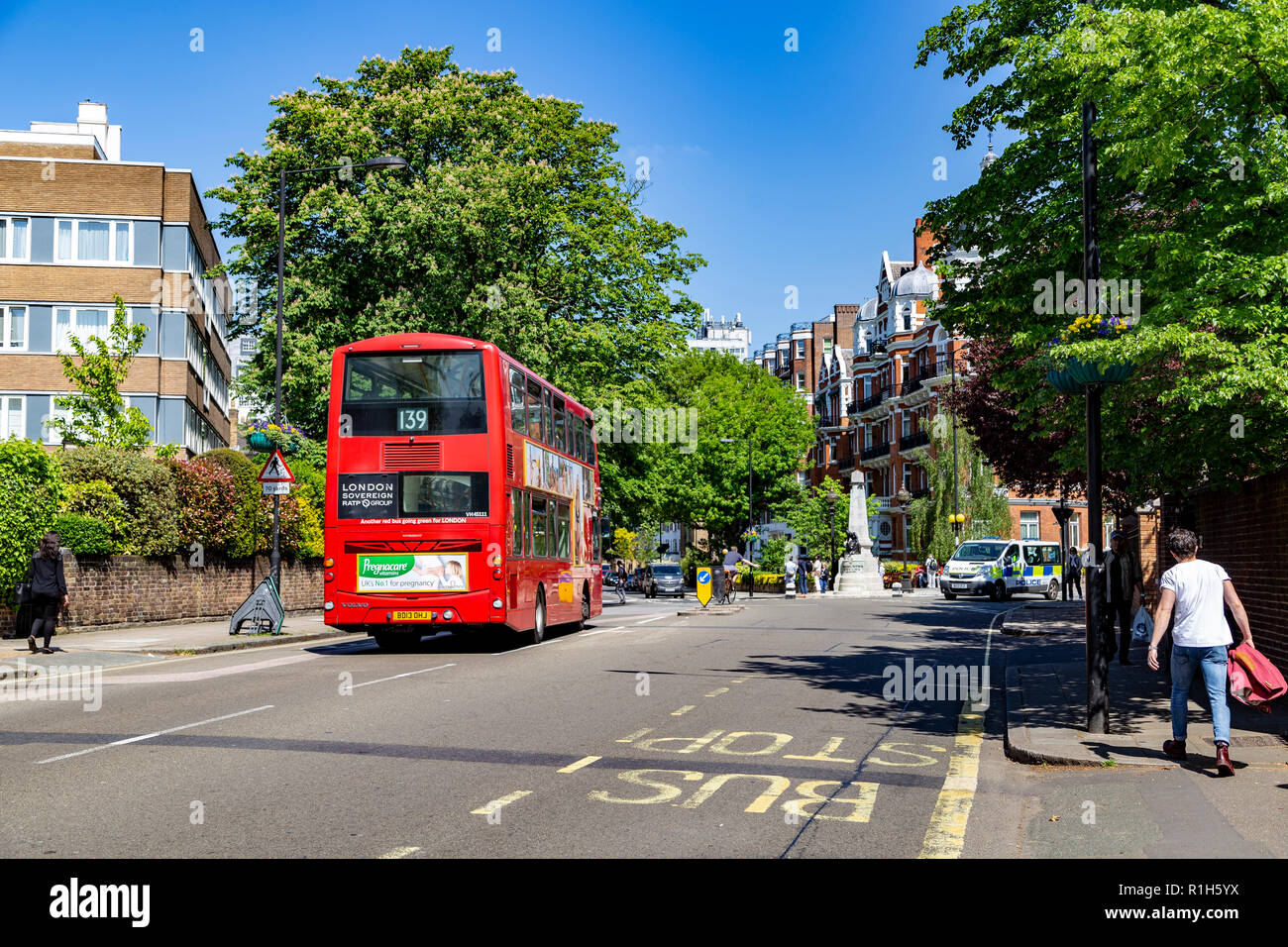 Tourists walking across the famous Abbey Road, London, United Kingdom ...