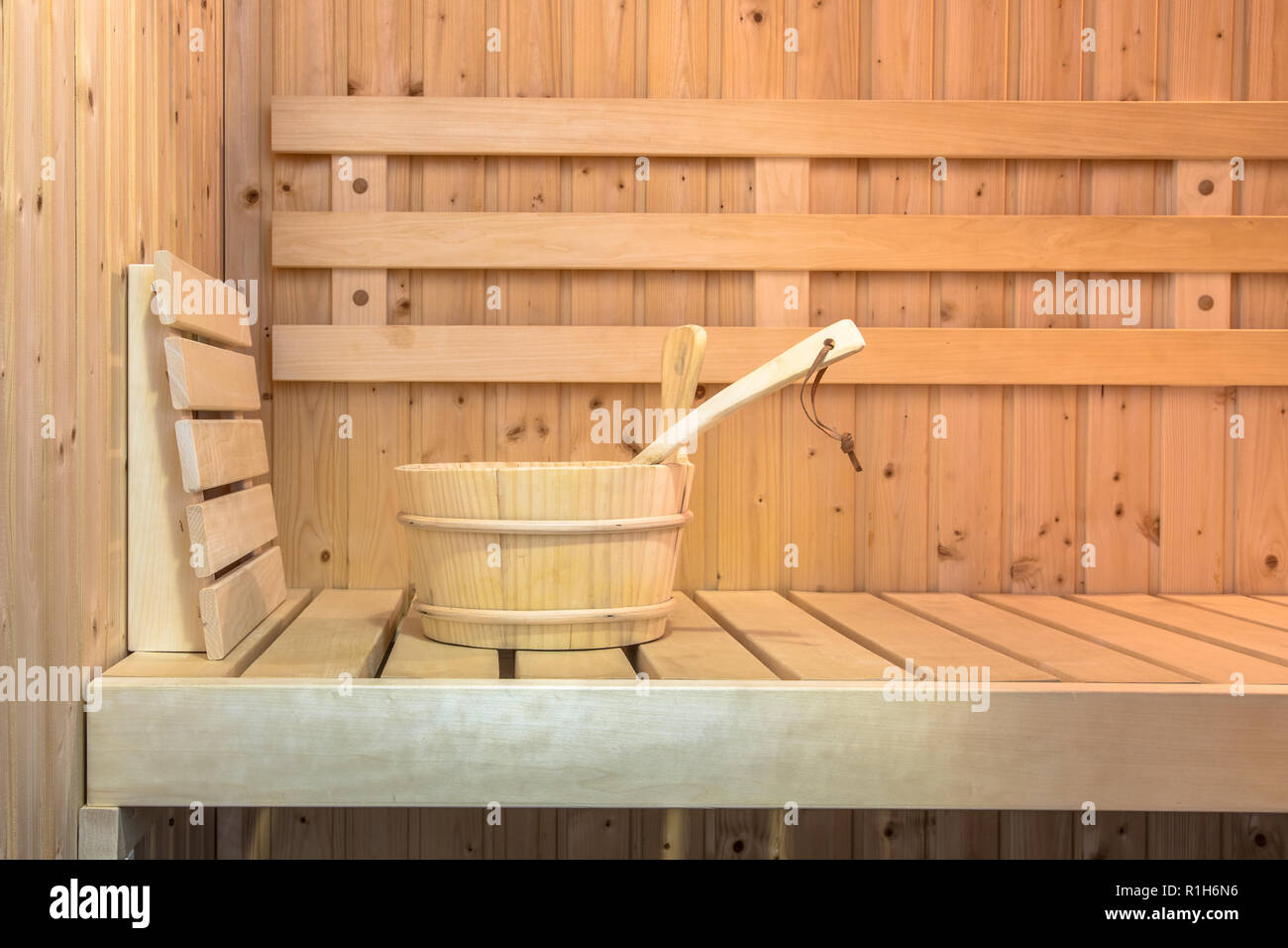 Seat in Interior of Finnish sauna with wooden bucket Stock Photo
