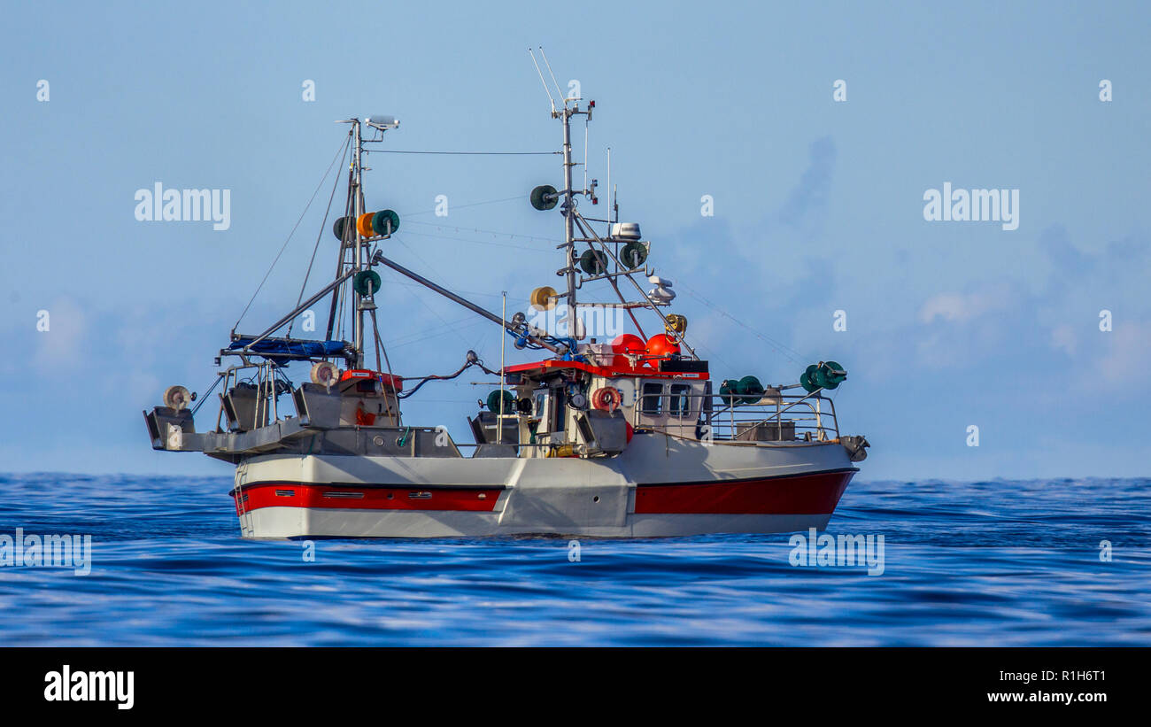 Sustainable Commercial hook line fishing vessel in Norwegian fjord Stock Photo