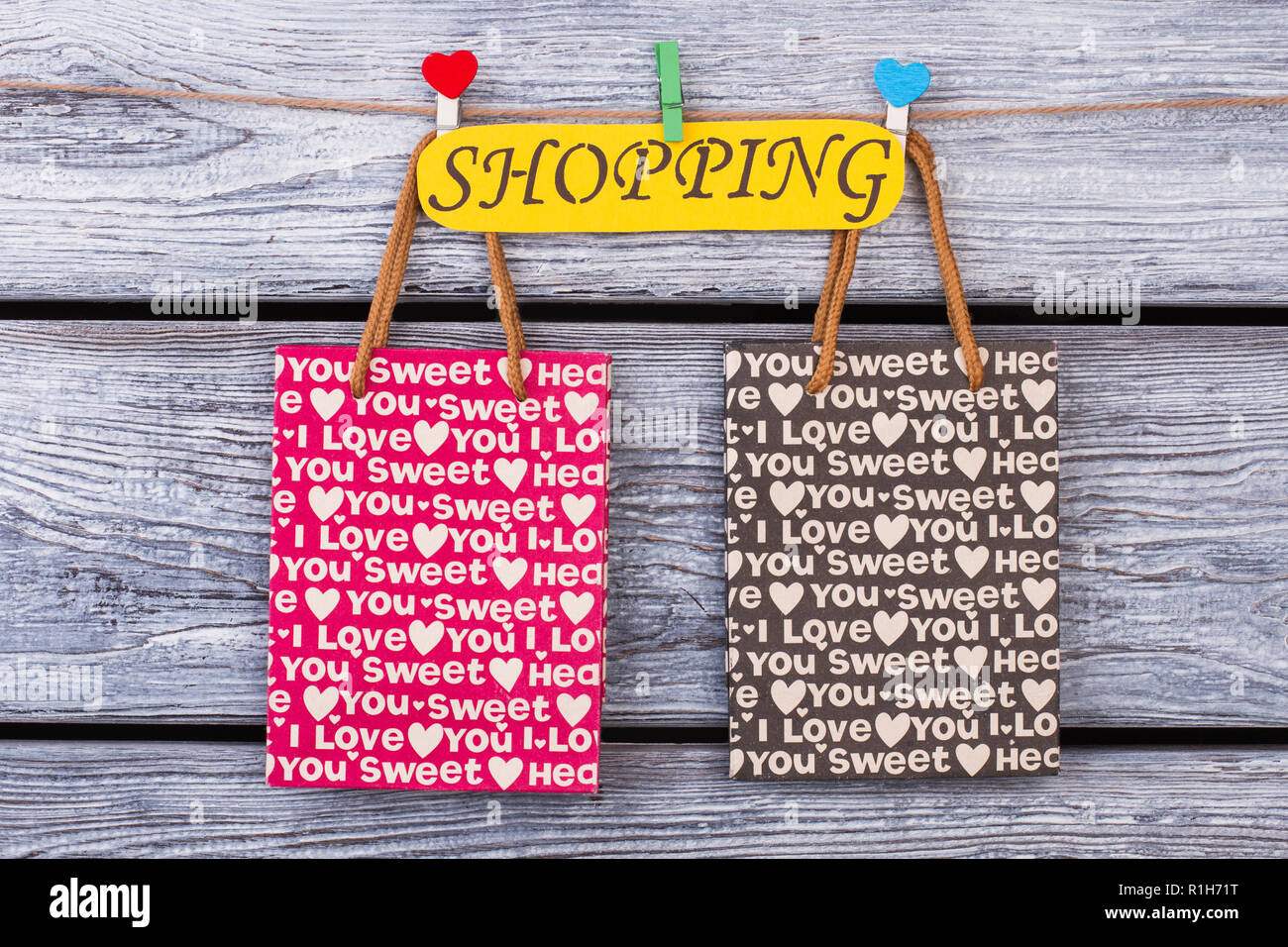 Paper shopping bags on wooden background. Stock Photo
