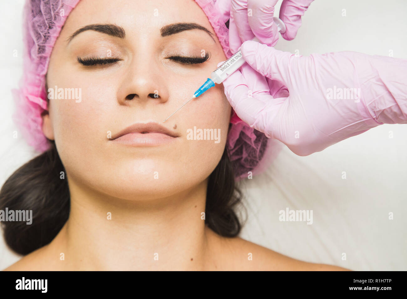 Young woman getting cosmetic injection in beauty clinic Stock Photo Alamy