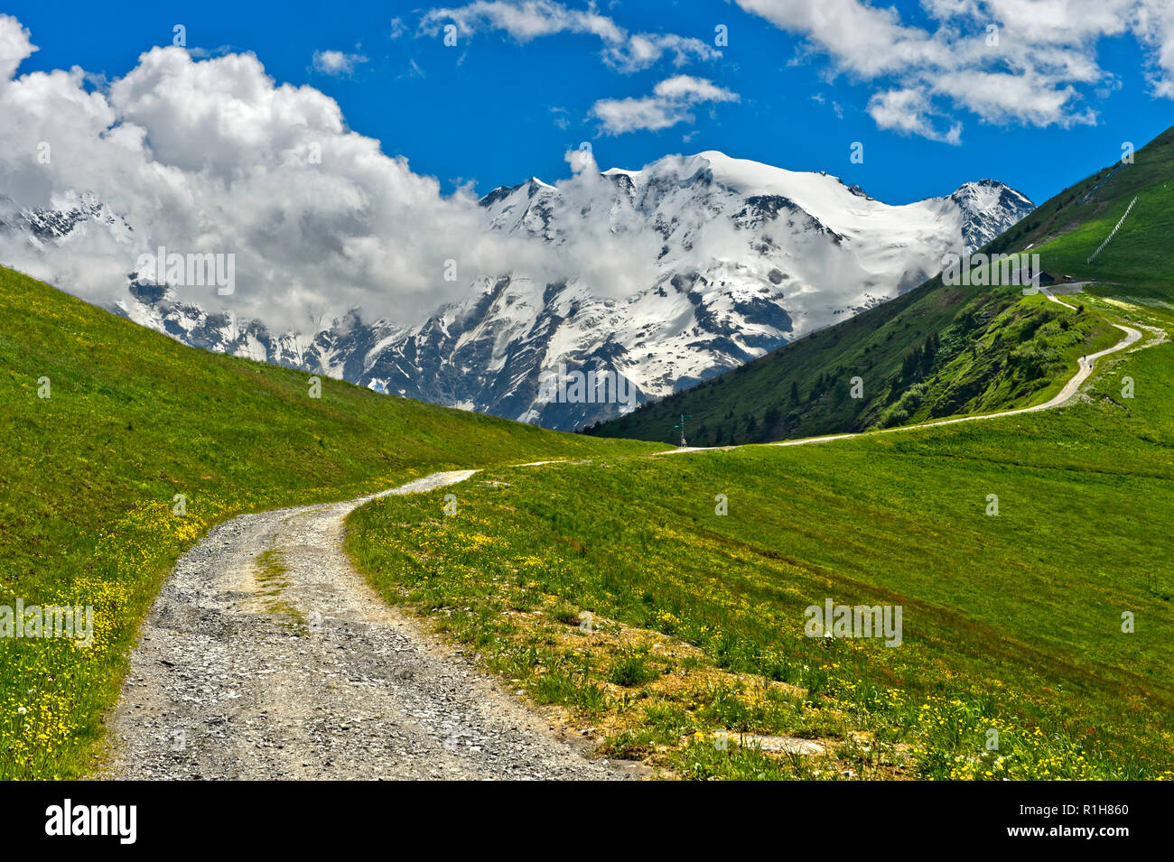 Hiking trail in front of the snow-covered Mont Blanc Group, Saint-Gervais-les-Bains, Haute Savoie, France Stock Photo
