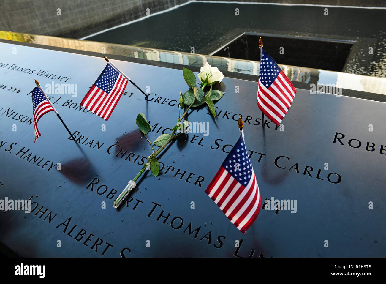 North Pool with flowers to commemorate the deceased, World Trade Center Memorial, 9-11 Memorial, Ground Zero, Manhattan Stock Photo