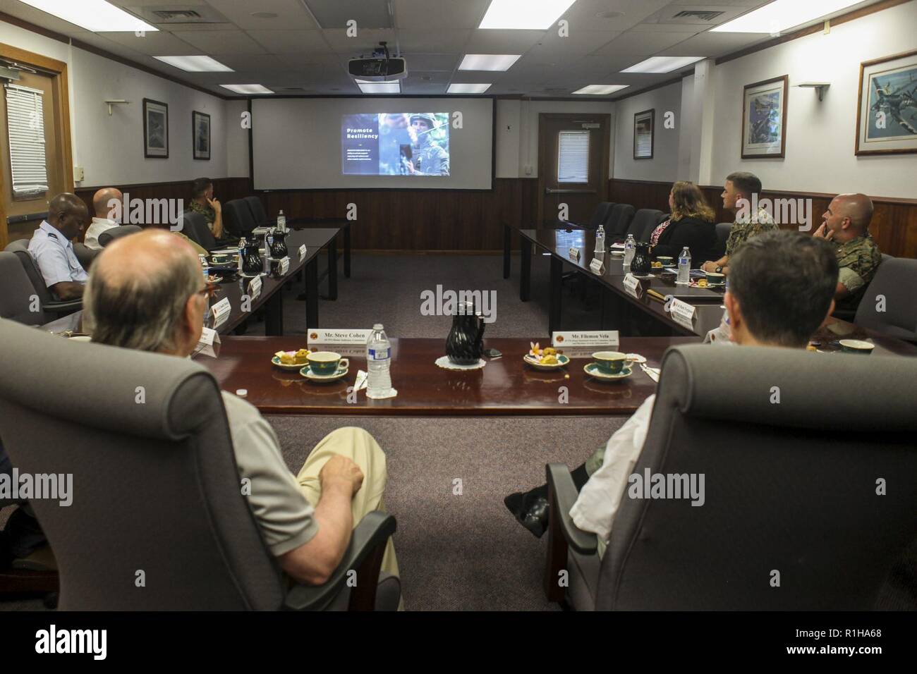 Rep. Steve Cohen (D-TN), House of Judiciary Committee, and Rep. Filemon Vela (D-TX), House of Homeland Security Committee, Border and Maritime Security Subcommittee, watch a video during a command brief at the Marine Corps Base Hawaii (MCBH) headquarters building, Sept. 19, 2018. Rep. Steve Cohen and Rep. Filemon Vela visited MCBH to learn about the installation's support to operational readiness while maintaining awareness of cultural and environmental issues within the training areas, ranges and other aspects of the region. With this engagement, the Representative's will provide Members of C Stock Photo