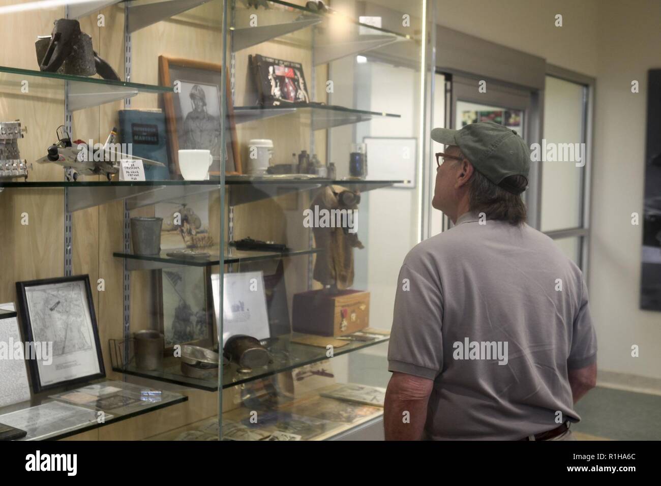 Rep. Steve Cohen (D-TN), House of Judiciary Committee, examines a display of historical items inside a display case at the Marine Corps Air Station Kaneohe Bay terminal during his visit to Marine Corps Base Hawaii (MCBH), Sept. 19, 2018. Rep. Steve Cohen and Rep. Filemon Vela (D-TX), House of Homeland Security Committee, Border and Maritime Security Subcommittee, visited MCBH to learn about the installation's support to operational readiness while maintaining awareness of cultural and environmental issues within the training areas, ranges and other aspects of the region. With this engagement,  Stock Photo