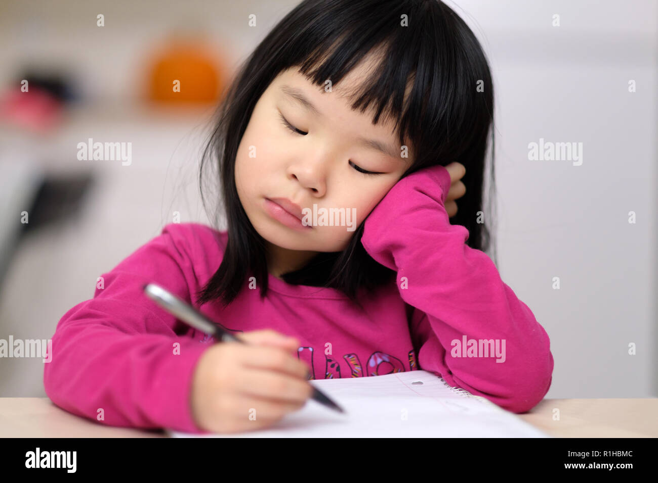 Early childhood education concept with little girl learn to write Stock Photo