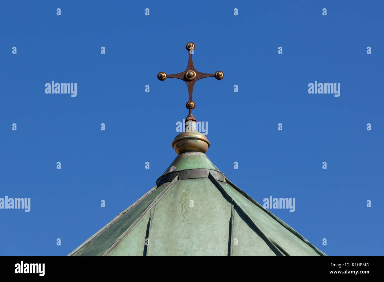 Zagreb, Croatia - October 2018. Top of the chapel in the cemetery with Christian cross at peaceful sunny day in autumn Stock Photo
