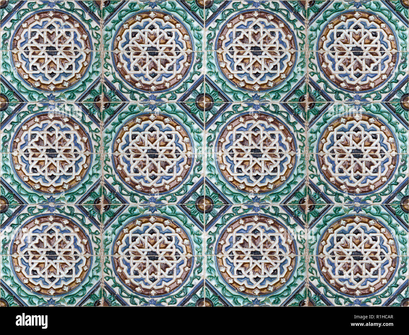 Old ceramic tiles with abstract pattern. Vintage glazed tiles texture and background. Stock Photo