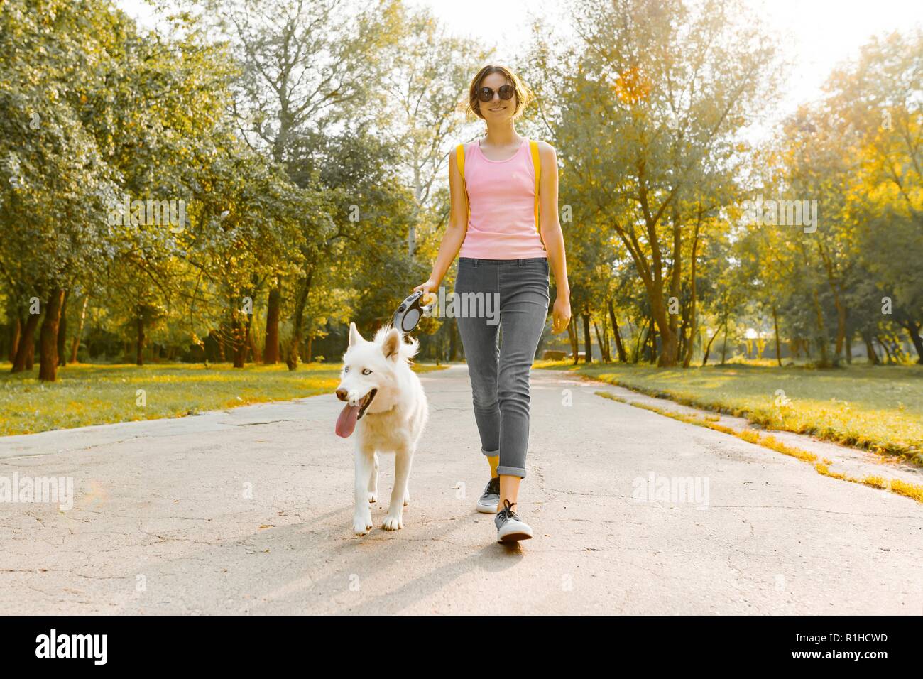 Teen girl walk dog hi-res stock photography and images - Alamy