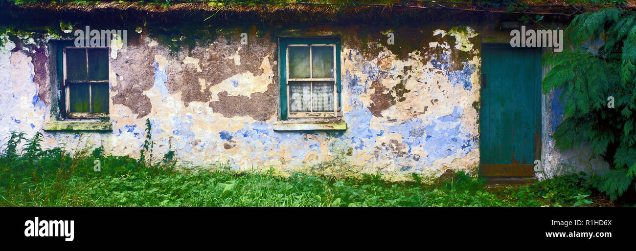 Panoramic image of old decaying cottage in rural Ireland. Stock Photo