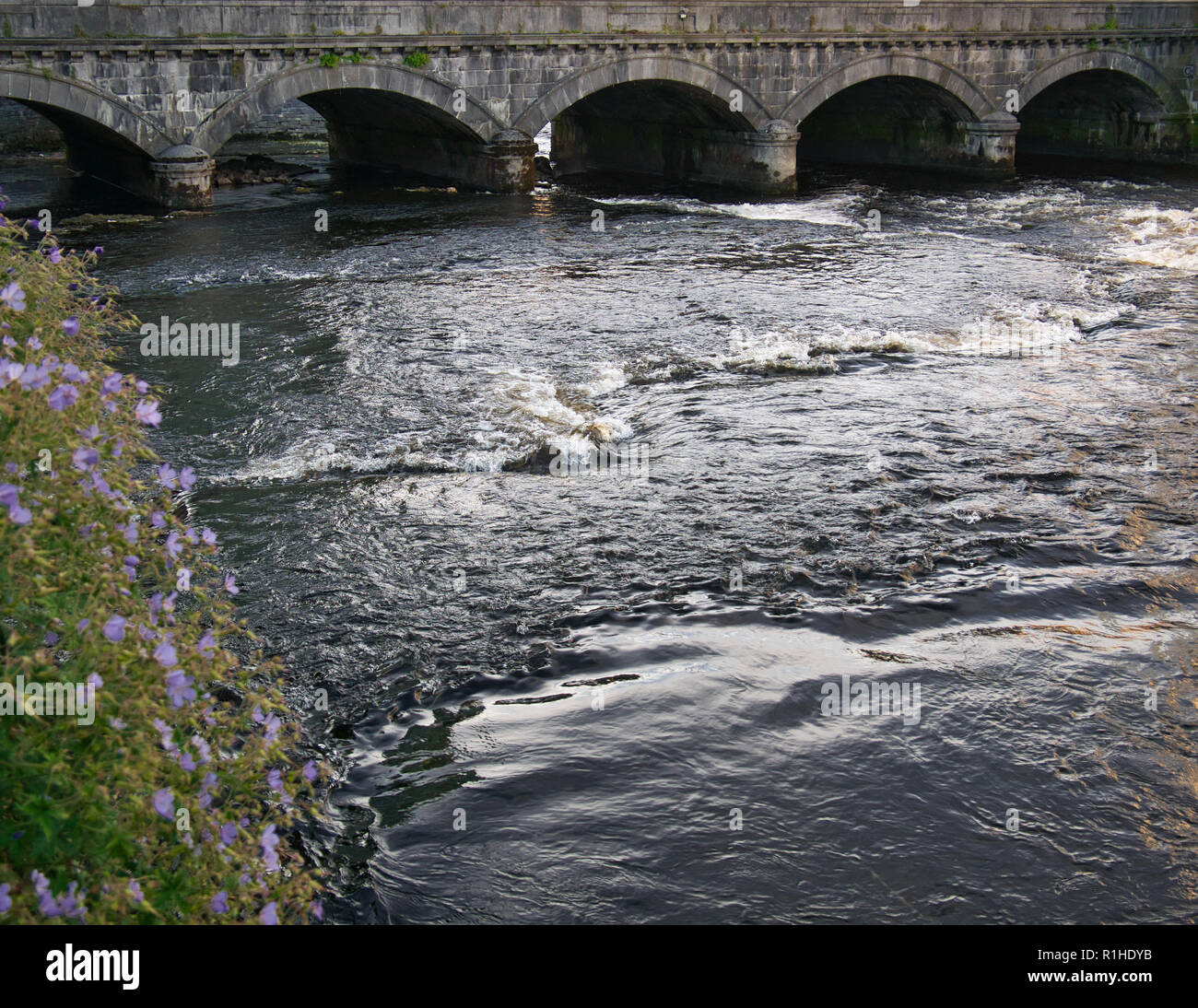 A stone bridge over the Garavogue River in the town of Sligo Stock Photo
