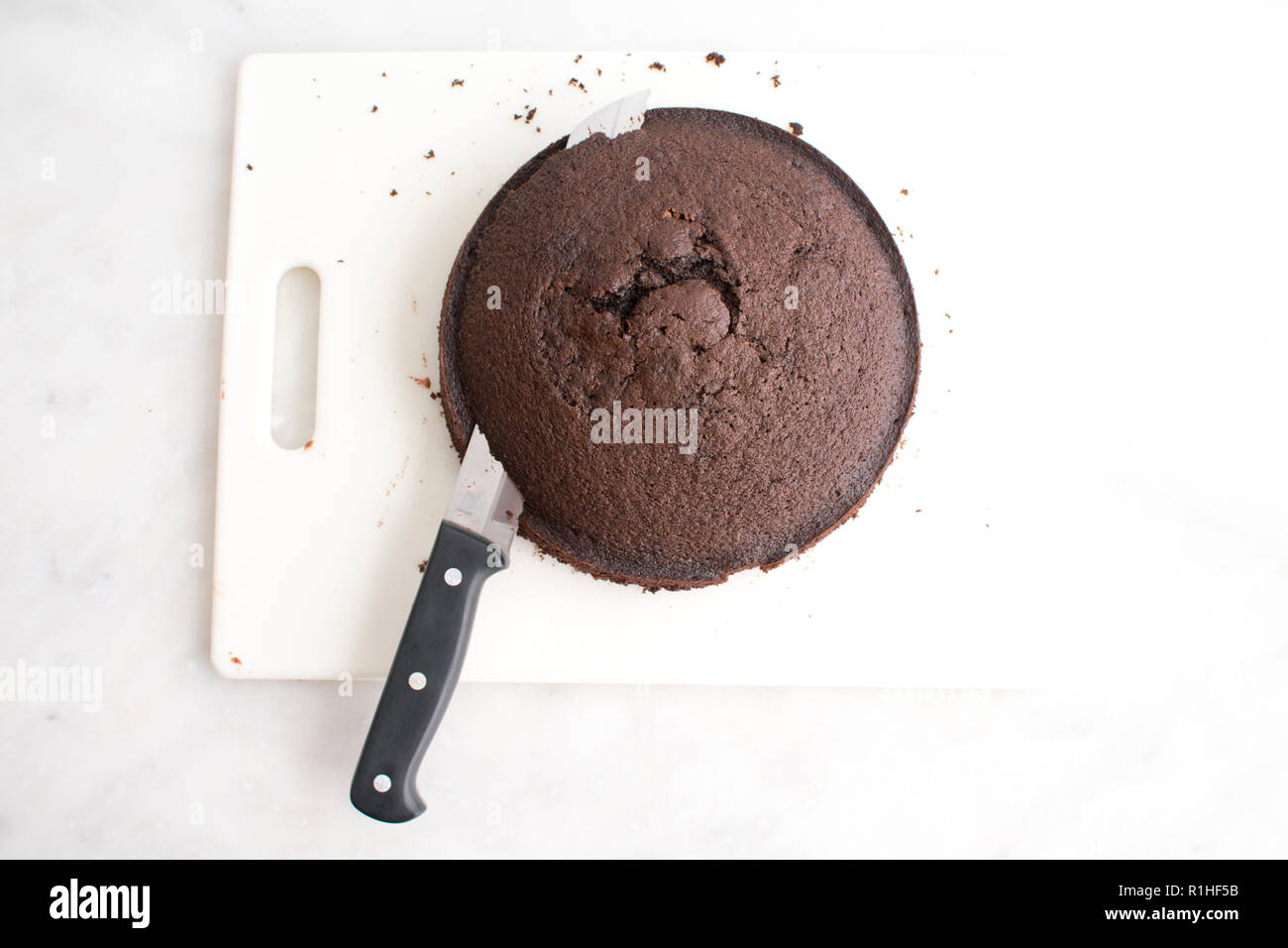 Leveling a Chocolate Cake Stock Photo