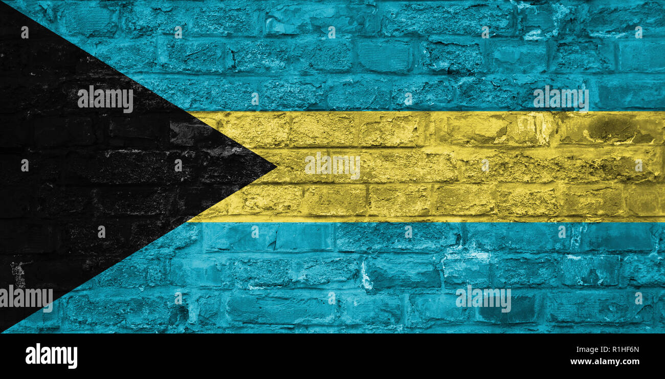 Flag of Bahamas over an old brick wall background, surface Stock Photo ...