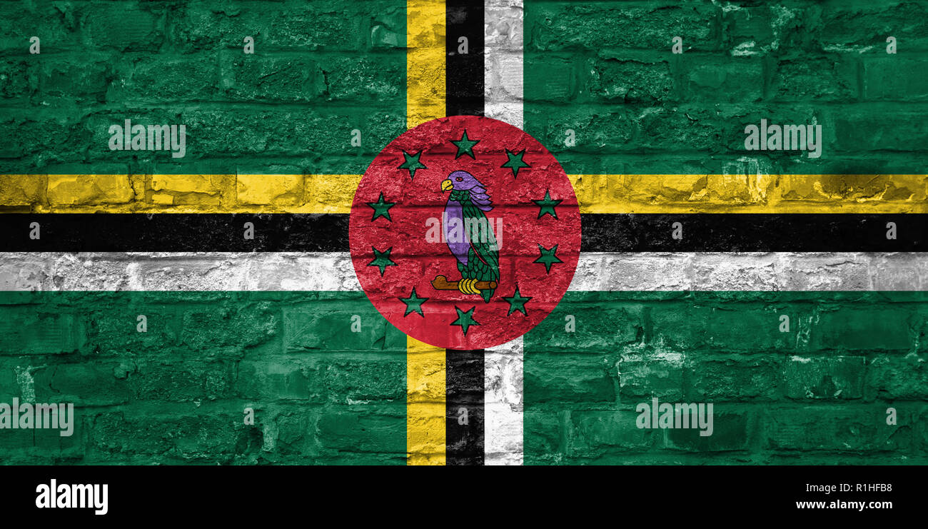 Flag of Dominica over an old brick wall background, surface Stock Photo ...