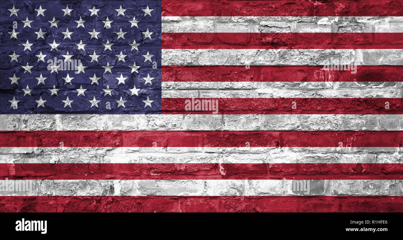 Flag of United States of America over an old brick wall background ...