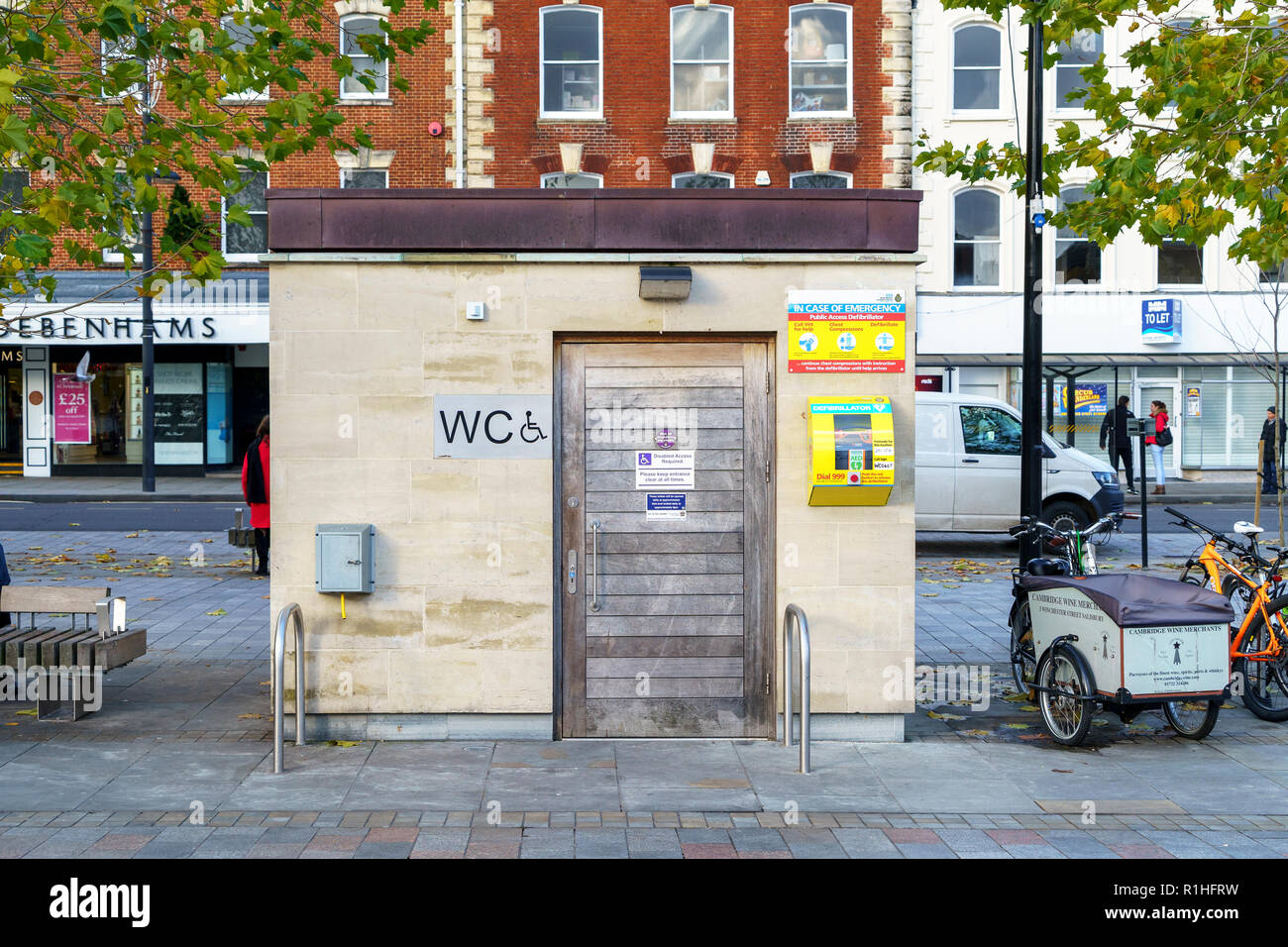 Purpose built disabled public toilet with emergency defibrillator attached Stock Photo