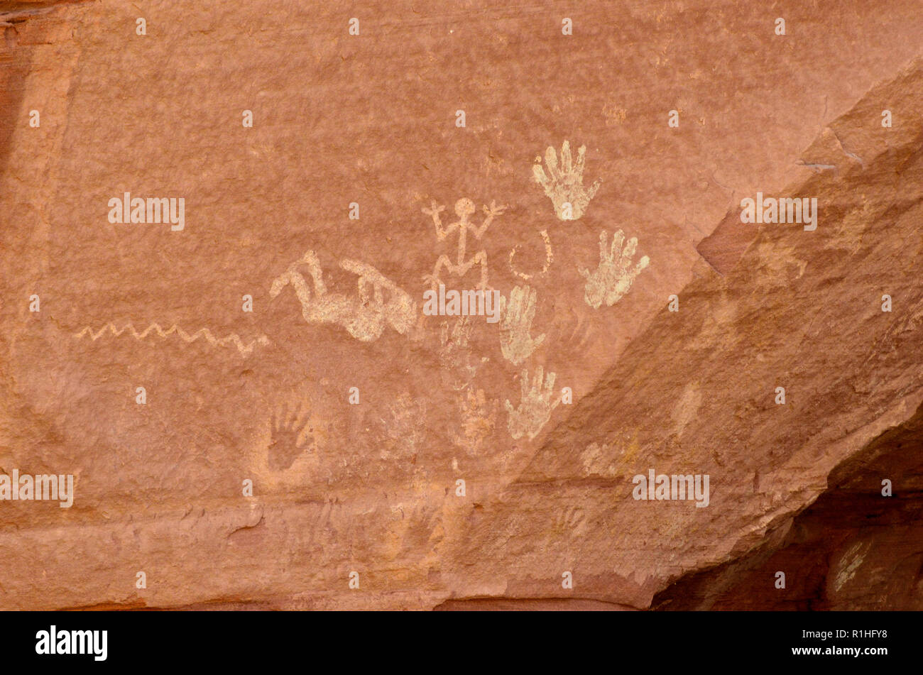 Pictographs: Wavy lines, Kokopelli, Stick figures, Circles, Hand prints, Kokopelli Cave, Canyon de Chelly National Monument, Chinle, Stock Photo