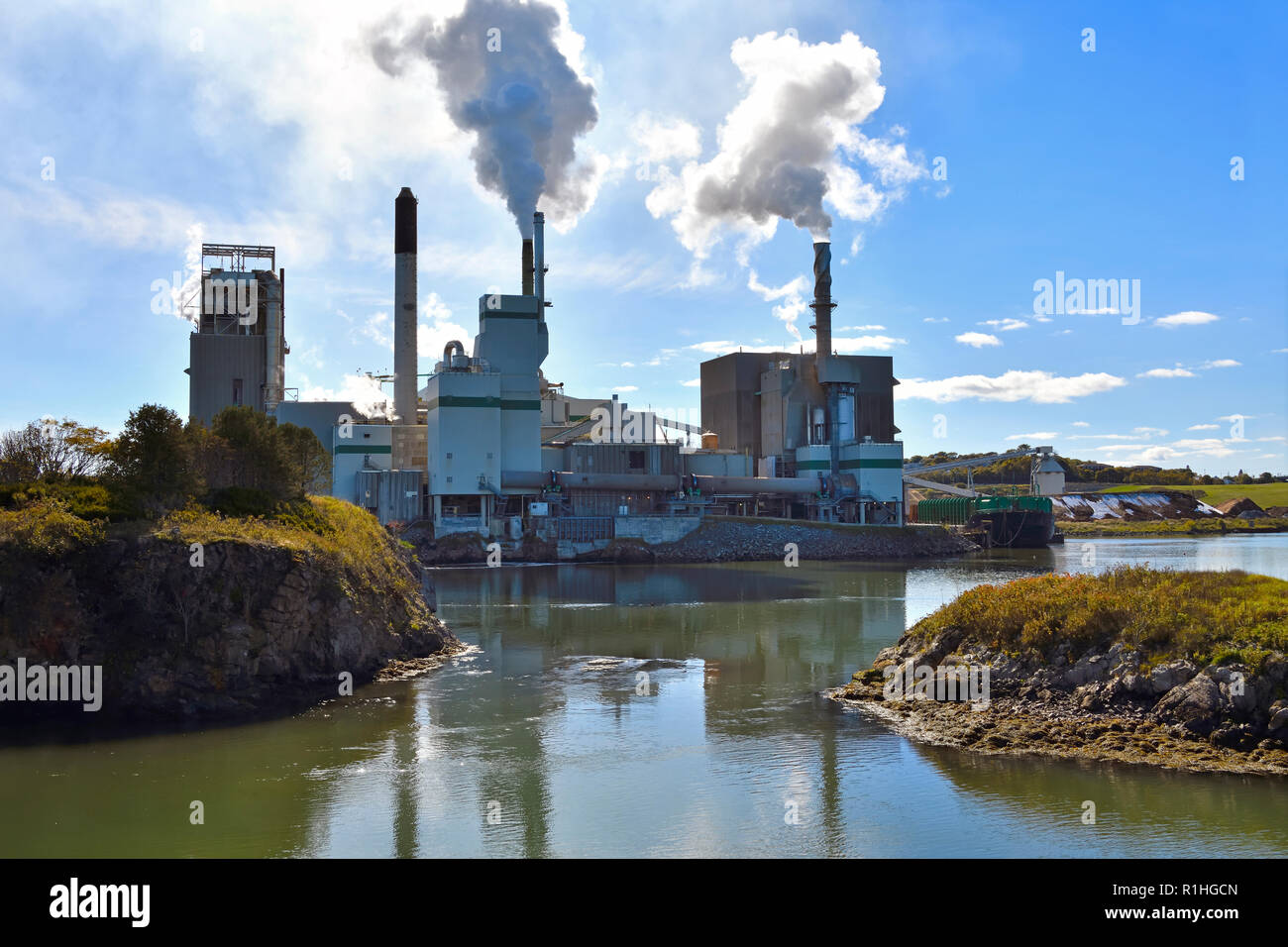 A horizontal landscape image of the Irving pulp mill situated at the famous Reversing Falls on the Saint John River in the city of Saint John New Brun Stock Photo