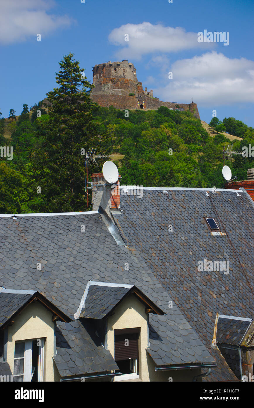 view of the castle (12 th - 16 th centuries) and rooftops of Murol in Auvergne, Puy de Dome, France Stock Photo