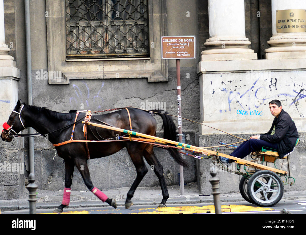 Riding his traditional horse cart in Catania, Italy. Stock Photo