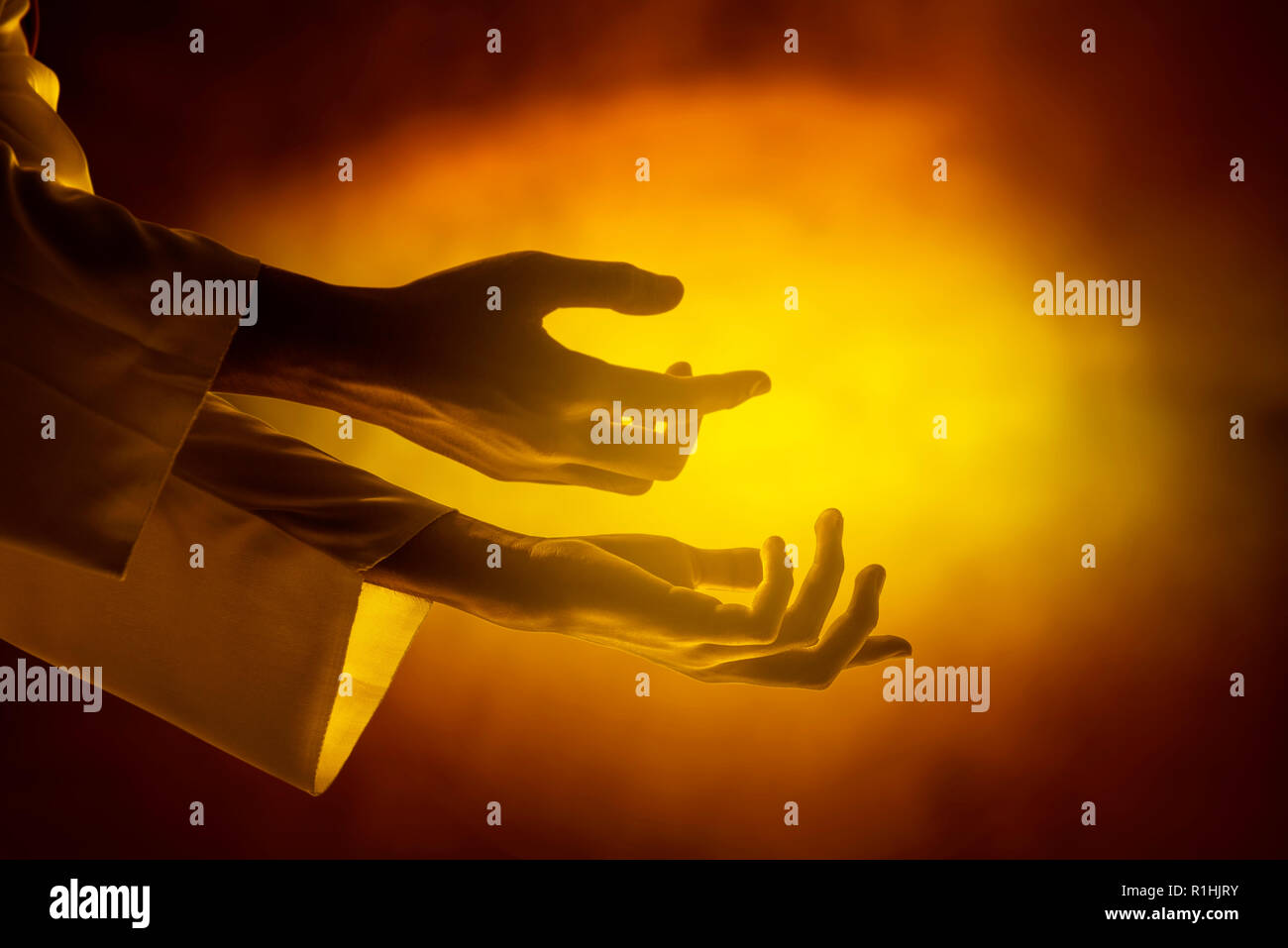 Hands of Jesus christ with open palm over yellow bright background Stock  Photo - Alamy