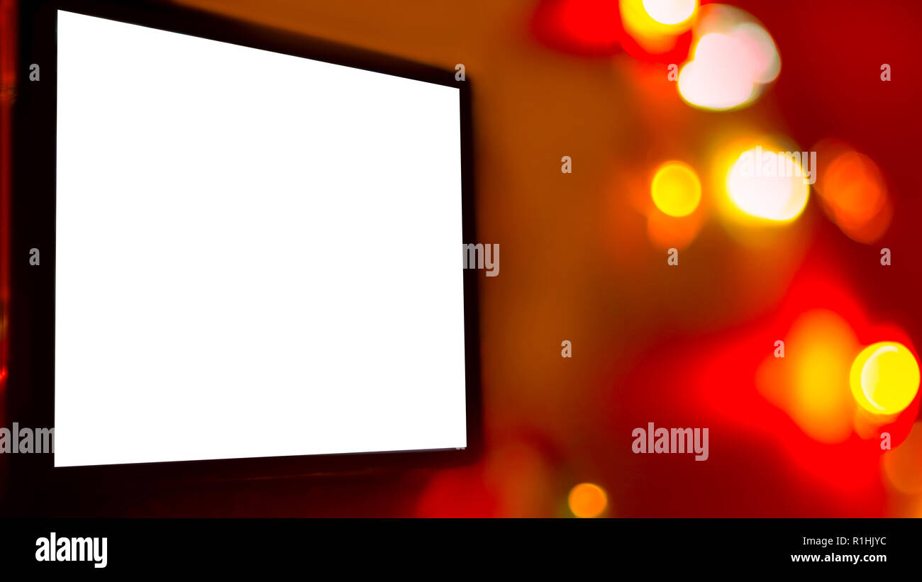 Blank White Screen Of A Digital Device, TV, Laptop, Smartphone, On Bright  Vivid Background Of Blurred Colorful Lights. Christmas, New Year, Seasonal  Stock Photo - Alamy