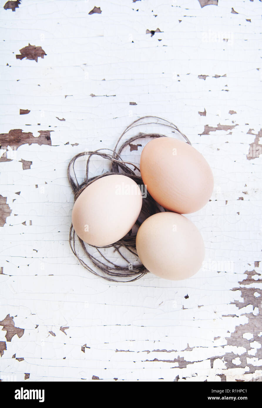 eggs lie on an old white table. Stock Photo