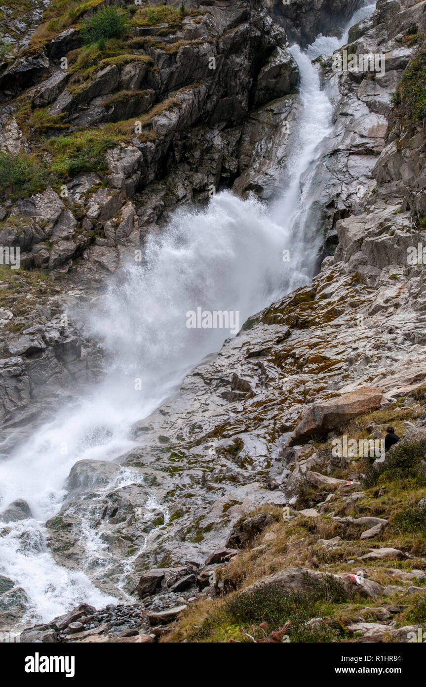 Close up of gushing water in a glacial waterfall. photographed at Sulzenaualm, Stubai, Tyrol, Austria Stock Photo