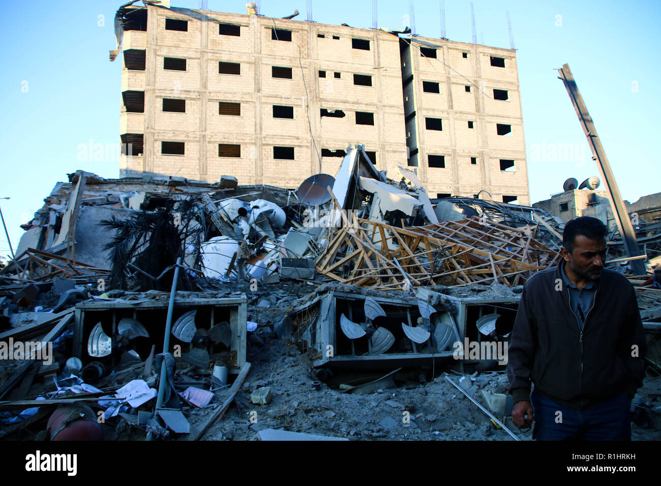 A man seen standing next to the rubble site of a building which was bombed by the Zionist occupation planes during the raids in the Gaza Strip. Stock Photo
