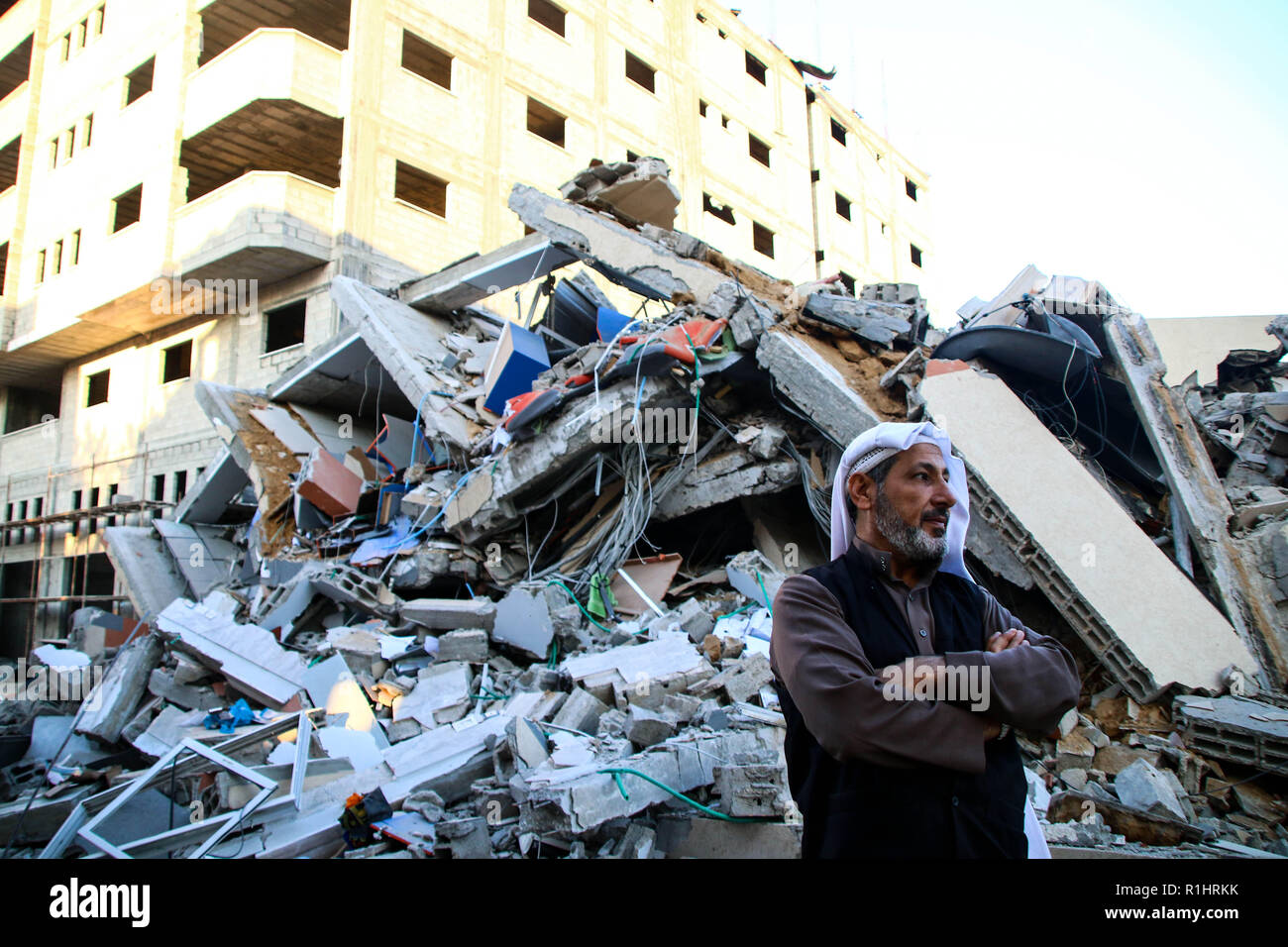 A man seen standing next to the rubble site of a building which was bombed by the Zionist occupation planes during the raids in the Gaza Strip. Stock Photo