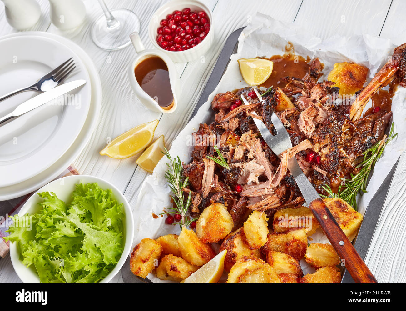 slow roast ultra tender shoulder of lamb pulled off the bones with