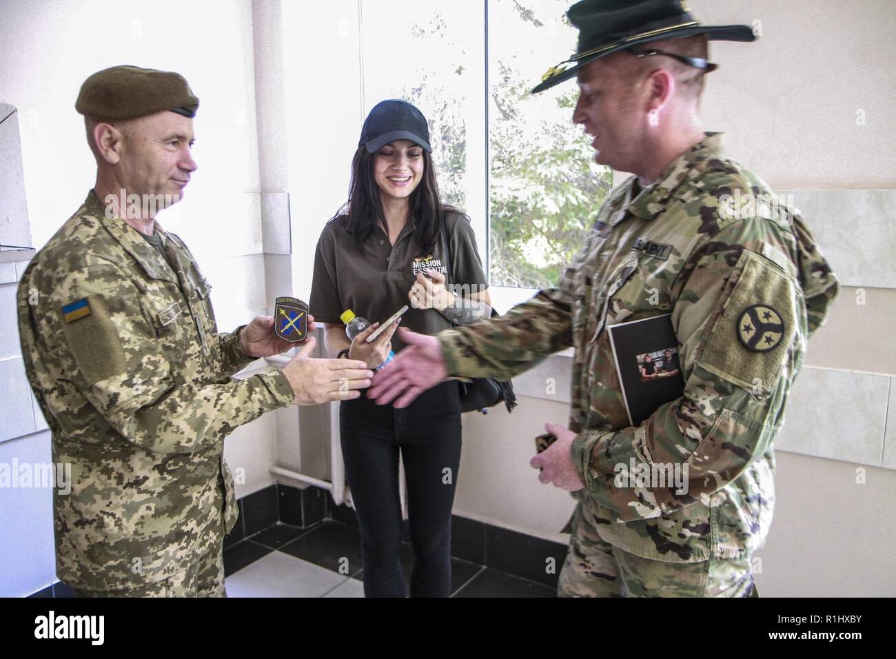 Maj. Wes Wingo exchanges patches with a Ukrainian officer Stock Photo