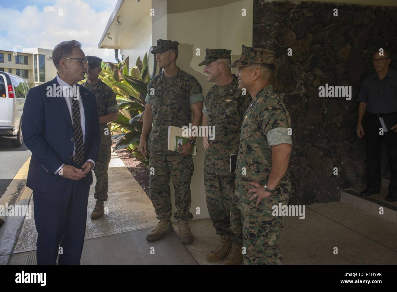 Under Secretary of the Navy, the Honorable Thomas B. Modly (left), is greeted by Brig. Gen. Robert Sofge (second from the right), deputy commander, U.S. Marine Corps Forces, Pacific, Col. Raul Lianez (right), commanding officer, Marine Corps Base Hawaii (MCBH), and Col. Stephen Lightfoot, commanding officer, Marine Aircraft Group 24, at the Officer’s Club during his visit to MCBH, Sept 21, 2018. Modly engaged with senior leaders from U.S. Marine Corps Forces, Pacific, Marine Corps Base Hawaii, and Marine Aircraft Group 24 to gain a better understanding of the aviation units and readiness of Ma Stock Photo