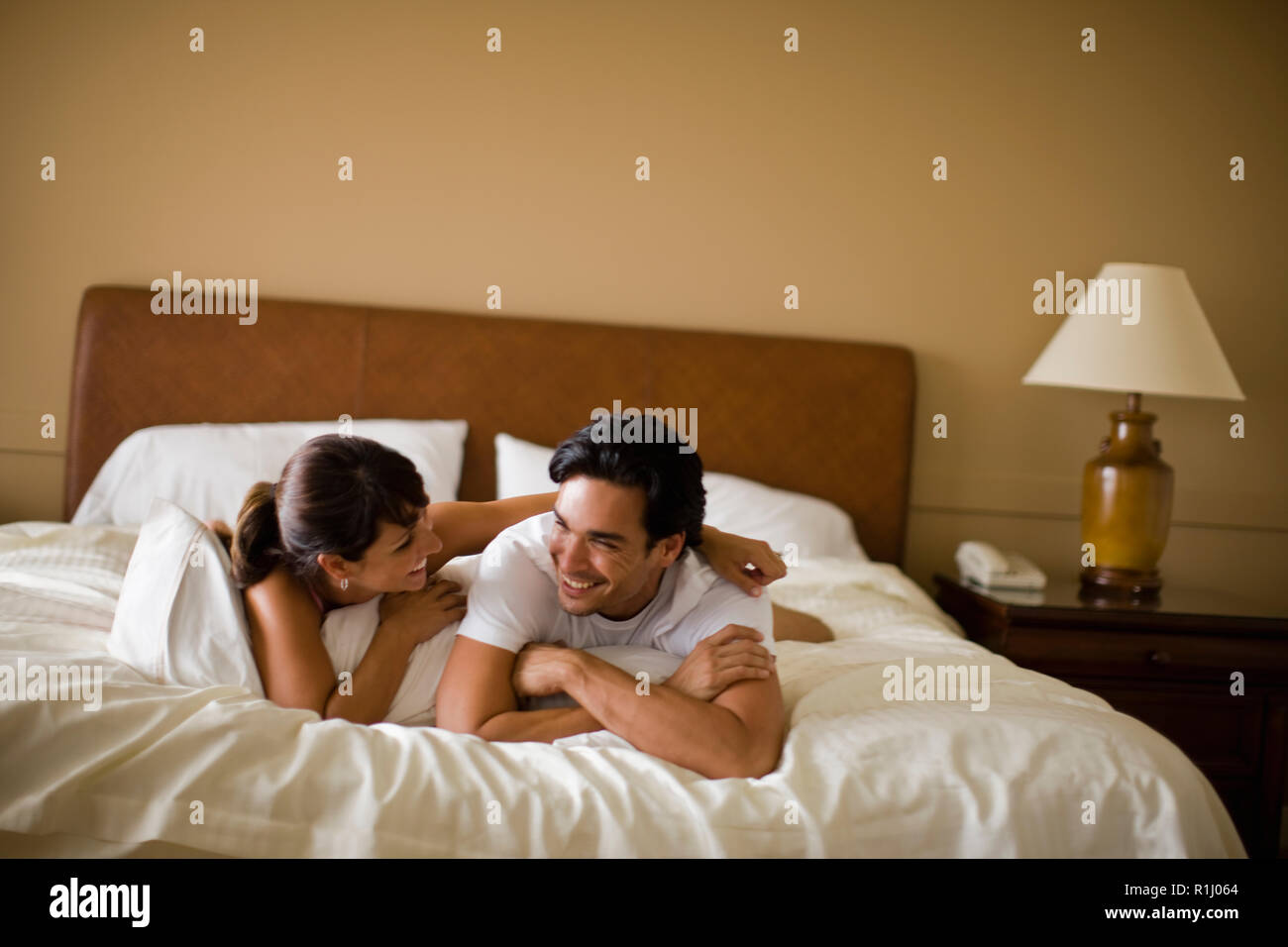 Young couple relaxes in bed hi-res stock photography and images - Alamy