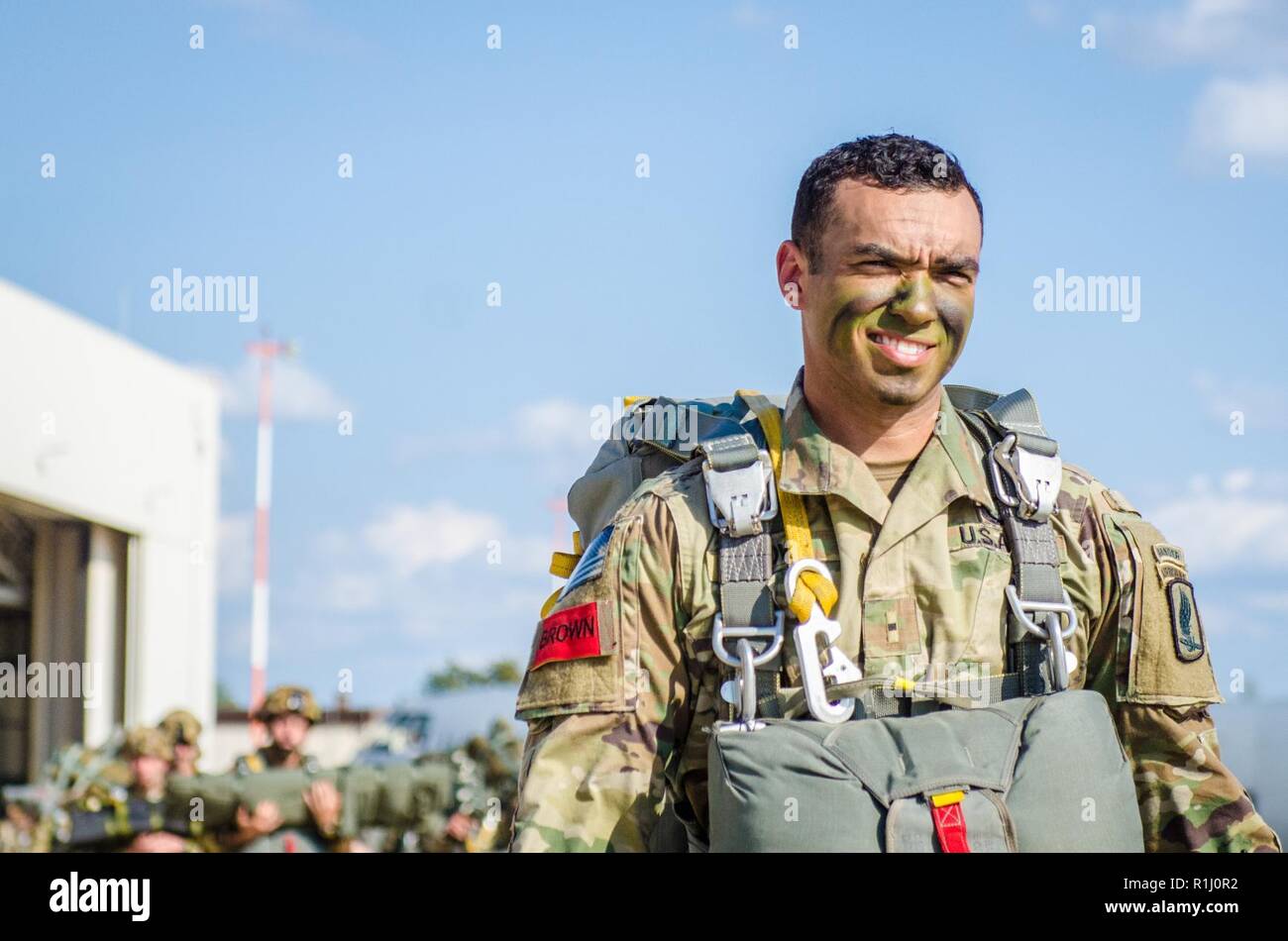 A U.S. Army jump master with the 173rd Airborne Brigade walks to U.S. Air Force C-130 aircraft during Saber Junction 18, at Ramstein Air Base, Germany, Sept. 19, 2018. Jump masters are the expert paratroopers in an Airborne unit who train and teach the Army techniques for jumping from airplanes. Saber Junction 18 is the U.S. Army 173rd Airborne Brigade’s combat training center certification exercise, taking place on the Grafenwoehr and Hohenfels training areas. The U.S. Army Europe-directed exercise is designed to assess the readiness of the brigade to conduct unified land operations in a join Stock Photo