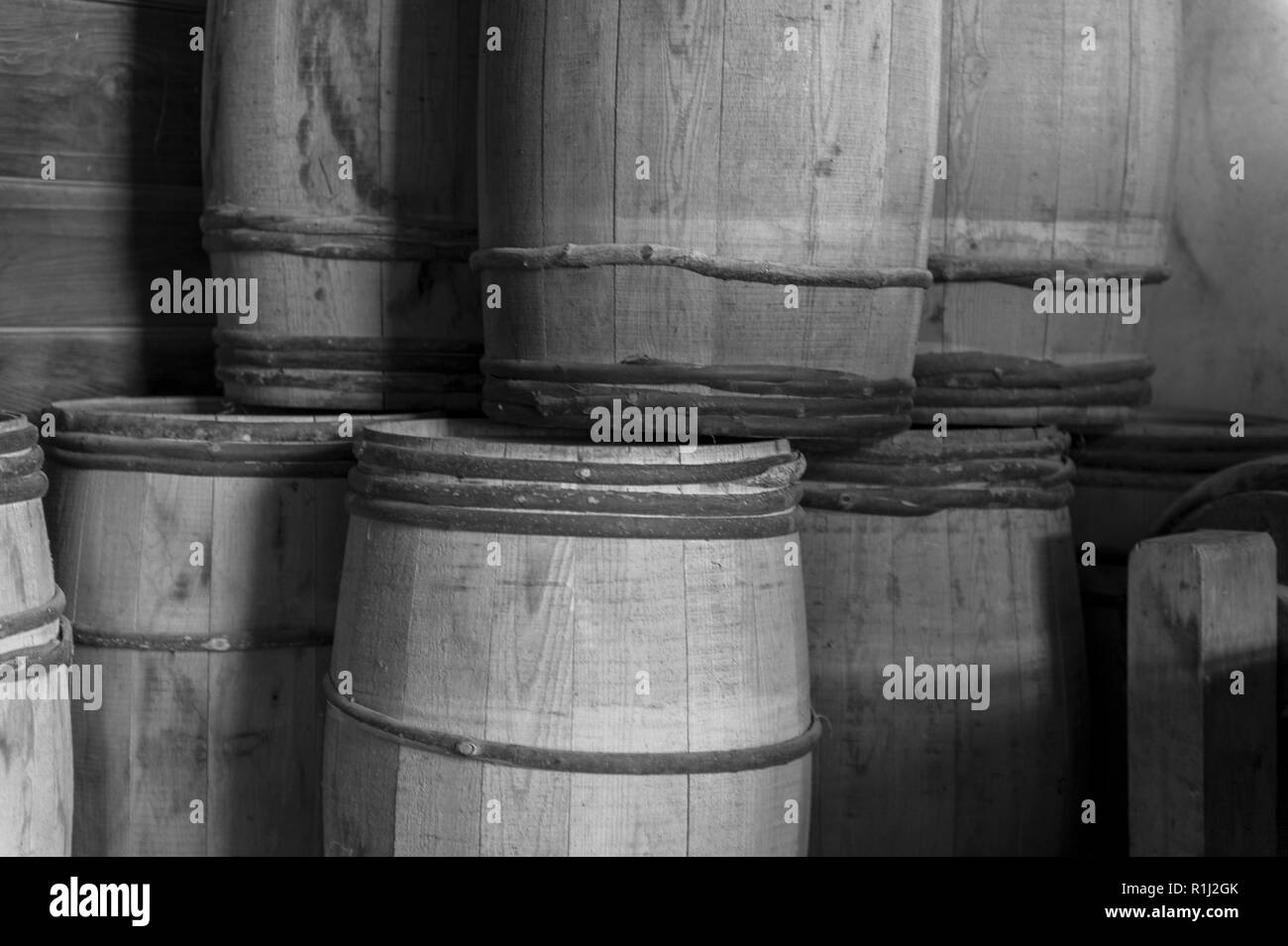 stockpile of old wooden barrels Stock Photo