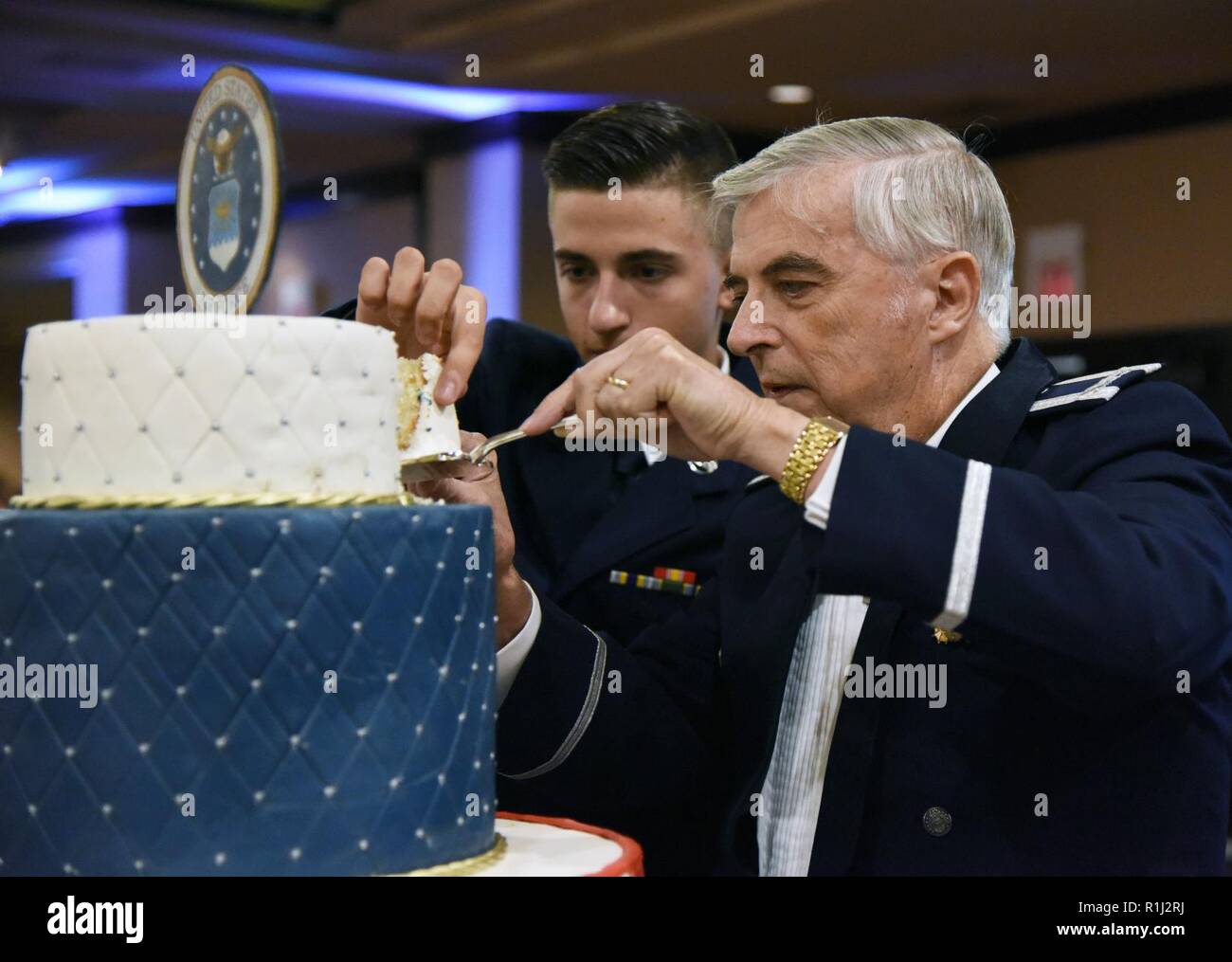 U.S. Air Force Airman 1st Class Warren Crouch, 334th Training Squadron student, and retired Col. Thomas Adams, participate in a cake cutting ceremony the U.S Air Force 71st Birthday Ball at the Imperial Palace Casino, Biloxi, Mississippi, Sept. 22, 2018. The event was hosted by the 81st Training Wing and the John C. Stennis Chapter Air Force Association. Stock Photo