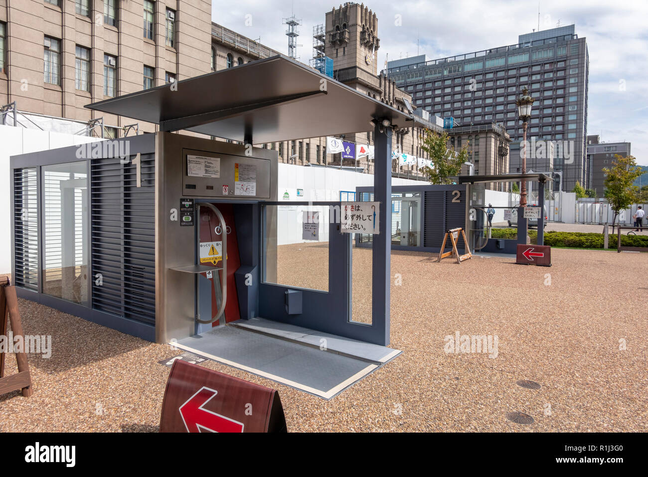 Entrance booth of a Giken Eco Cycle automated underground bicycle parking in front of Kyoto City Hall, Japan. Stock Photo