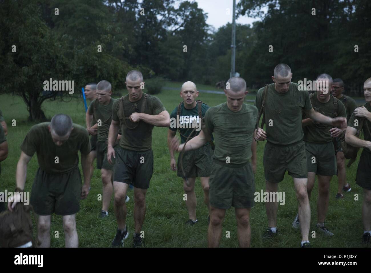 U.S. Marine officer candidates of Charlie and Delta Company, Officer Candidate School (OCS), execute the Muscular Endurance Course, consisting of kettle bell workouts, sit ups, and calisthenics at Quantico, Va. Sept. 23, 2018. Candidates must complete various exercises and tasks to complete the requirements of OCS to become a Marine Commissioned Officer. Stock Photo