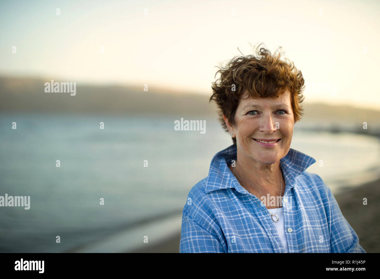 Portrait of a smiling mature woman Stock Photo - Alamy