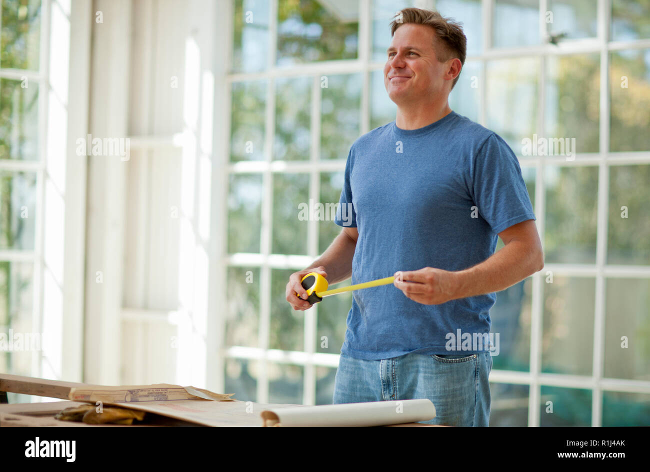 Mid adult man working on a construction site. Stock Photo