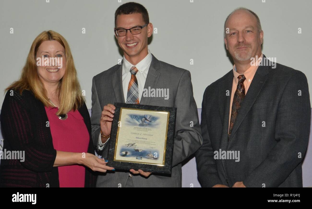DAHLGREN, Va. (Sept. 21, 2018) – Dillard Patton receives his certificate of achievement from Naval Surface Warfare Center Dahlgren Division (NSWCDD) Acting Chief of Staff Terri Gray and Acting Deputy Technical Director Chris Clifford at the 2018 NSWCDD Academic Recognition Ceremony. Patton –  commissioned into the Naval Reserves ten days earlier – was recognized for completing his master's degree in systems engineering from Old Dominion University, and commended for his commitment to personal and professional development. Stock Photo